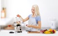 Smiling woman with blender preparing shake Royalty Free Stock Photo