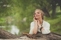 Smiling woman in boho style dress at the lake outdoor Royalty Free Stock Photo