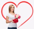 Smiling woman with bouquet of flowers and gift box Royalty Free Stock Photo