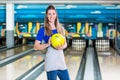 Smiling woman with bowling ball Royalty Free Stock Photo