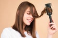 Smiling Woman Brushing Hair With Comb. Beautiful Girl With Long Hair Hairbrush.