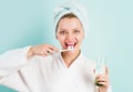 Smiling Woman brushing teeth with Toothpaste and toothbrush in bathroom. Dental higiene. Ceaning teeth. Royalty Free Stock Photo