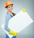 Smiling woman builder holding white banner.