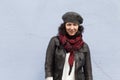 Smiling woman bundled up in stylish clothes