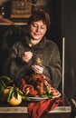 Smiling woman burning sparkles over Christmas dinner whole roasted turkey