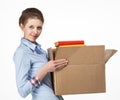 Smiling woman carrying a box with books Royalty Free Stock Photo