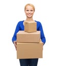 Smiling woman in casual clothes with parcel boxes Royalty Free Stock Photo