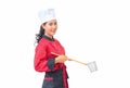 Woman chef holding cooking utensils