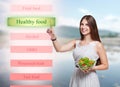 Smiling woman choose healthy food on futuristic screen Royalty Free Stock Photo