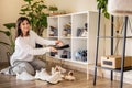 Smiling woman choosing footwear shoes closet comfortable storage contemporary organize at home Royalty Free Stock Photo