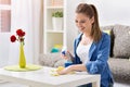 Smiling woman cleaning the table