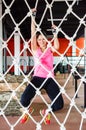 Smiling woman climbing on rope Royalty Free Stock Photo