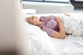 Smiling woman with closed eyes resting at home Royalty Free Stock Photo