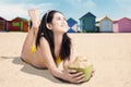 Smiling woman with coconut drink Royalty Free Stock Photo