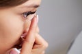 Smiling woman with contact eye lenses and container in hand Royalty Free Stock Photo