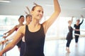 Smiling woman dancing ballet and looking away in class Royalty Free Stock Photo