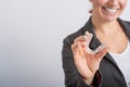 Smiling woman demonstrates mouth guards for bite alignment. The girl approves of the plastic removable braces for the