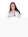 Smiling woman doctor with a banner. Isolated.