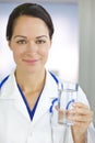 Smiling Woman Doctor Holding Glass of Water Royalty Free Stock Photo