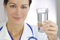 Smiling Woman Doctor Holding Glass of Water Royalty Free Stock Photo