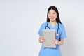 Smiling woman doctor holding laptop and stethoscope isolated on white background Royalty Free Stock Photo