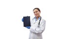 Smiling woman doctor holding tablet near her face and showing the screen to the camera isolated on white background Royalty Free Stock Photo