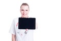 Smiling woman doctor or medic showing blank screen tablet Royalty Free Stock Photo