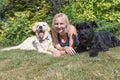 Smiling woman with dogs on the lawn