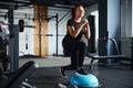 Smiling woman doing legs workout in gym Royalty Free Stock Photo