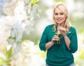 Smiling woman drinking vegetable juice or smoothie Royalty Free Stock Photo