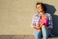 Smiling woman drinking water reading book. Royalty Free Stock Photo