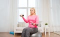 Smiling woman with dumbbells exercising at home Royalty Free Stock Photo