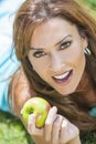 Smiling Woman Eating Apple With Perfect Teeth Royalty Free Stock Photo