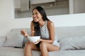 Smiling woman eating healthy breakfast at home in morning Royalty Free Stock Photo