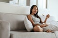 Smiling woman eating healthy breakfast at home in morning Royalty Free Stock Photo