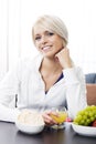 Smiling woman enjoying a healthy diet Royalty Free Stock Photo