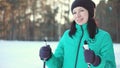 Smiling woman enjoying winter in a forest