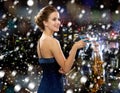 Smiling woman in evening dress holding cocktail Royalty Free Stock Photo