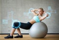 Smiling woman with exercise ball in gym Royalty Free Stock Photo