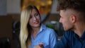 Smiling woman explaining new project to her male partner while sitting in cafe. Couple having lunch and talking Royalty Free Stock Photo