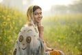 Smiling woman farmer in rapeseed agricultural field Royalty Free Stock Photo