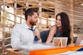 Smiling woman flirting with her boss Royalty Free Stock Photo