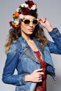 Smiling woman in flower crown wearing sunglasses Royalty Free Stock Photo