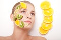 Smiling woman with fruit mask on her face isolated Royalty Free Stock Photo