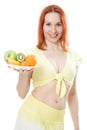 Smiling woman with fruit on a plate Royalty Free Stock Photo