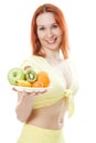 Smiling woman with fruit on a plate Royalty Free Stock Photo