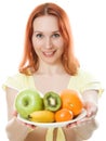 Smiling woman with fruit on a plate Royalty Free Stock Photo