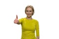 Smiling woman giving thumbs up on white background. Royalty Free Stock Photo