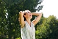 Smiling woman with hands in hair Royalty Free Stock Photo