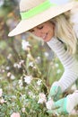 Smiling woman with hat gardening Royalty Free Stock Photo